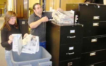 Wanda Whitworth and Clarence Skaw recycling newspaper at NRD Office
